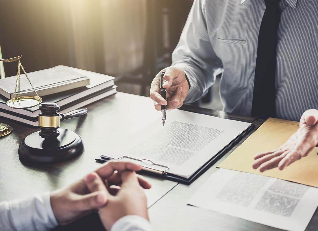 Legal Professional Insurance - Close-up of Businessman and Lawyer Having a Meeting in the Office With Law and Legal Services Concept